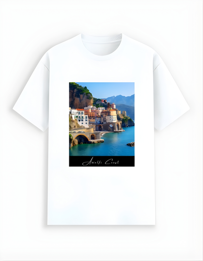 White t-shirt with a scenic print of a coastal town on a white background
