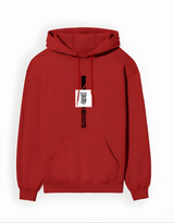 Red hoodie with a white label on a white background
